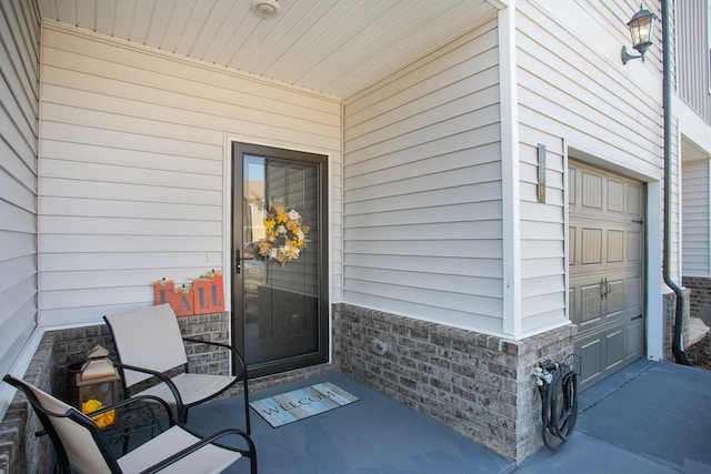 property entrance with a garage