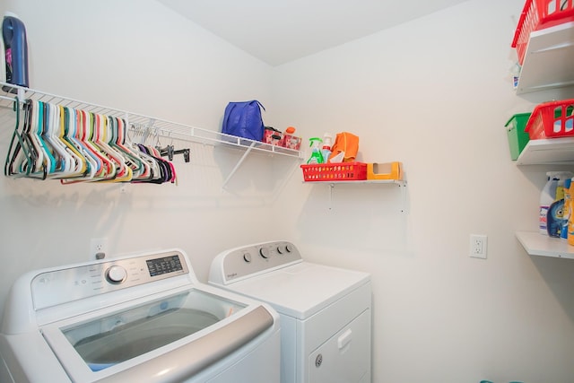 washroom with independent washer and dryer