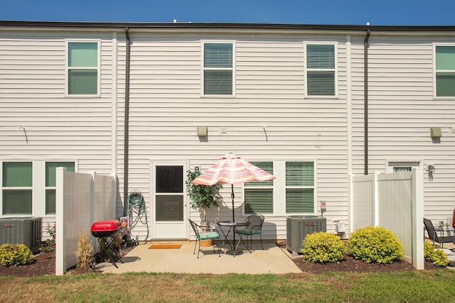 back of property featuring a patio and central AC unit