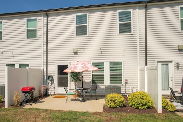 back of house with a patio area and central air condition unit