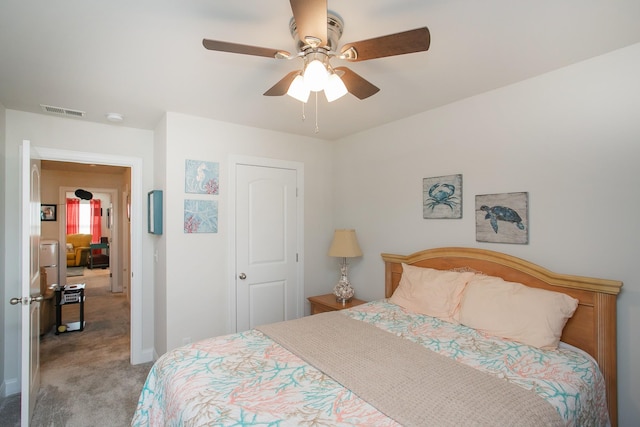 bedroom with ceiling fan and light colored carpet