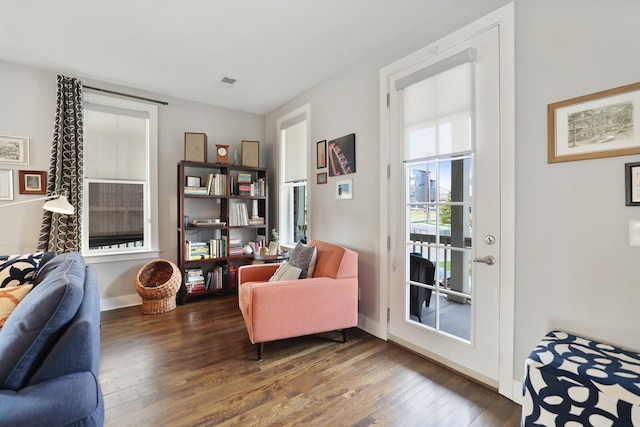 living area featuring dark wood-type flooring