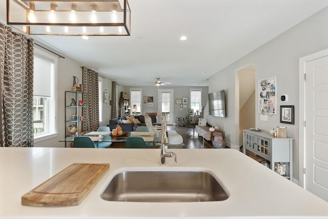 kitchen featuring ceiling fan and plenty of natural light