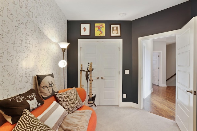 foyer entrance featuring carpet flooring