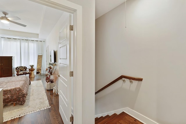 interior space with dark wood-type flooring and ceiling fan