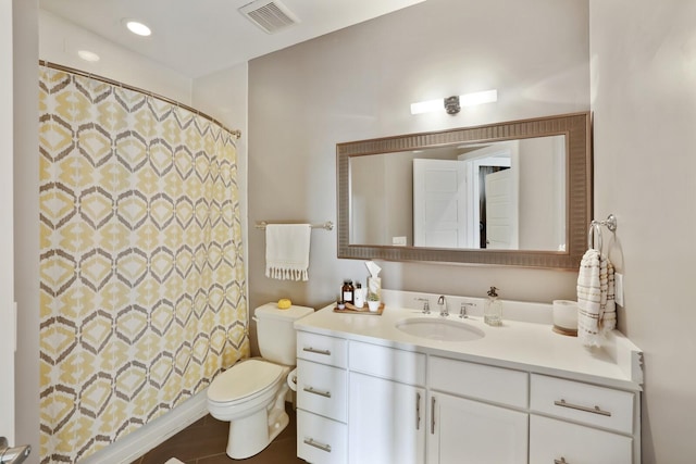 bathroom featuring vanity and toilet