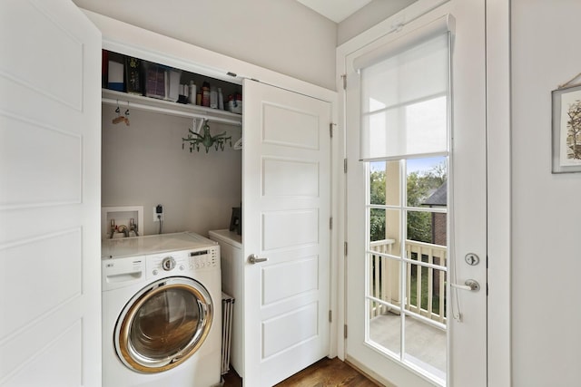 laundry room with dark wood-type flooring and washer / clothes dryer