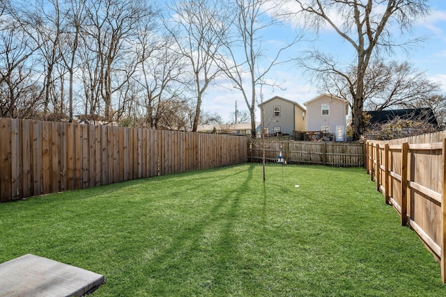 view of yard featuring a fenced backyard