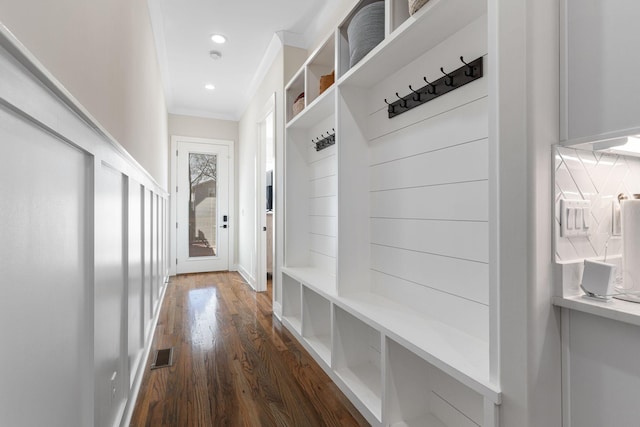 mudroom featuring recessed lighting, dark wood-style flooring, visible vents, and crown molding