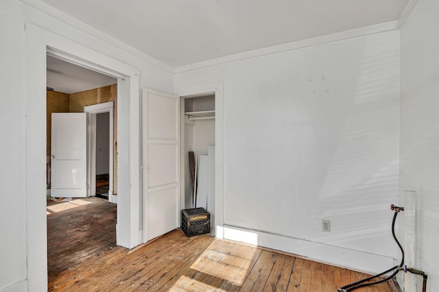 unfurnished bedroom with wood-type flooring