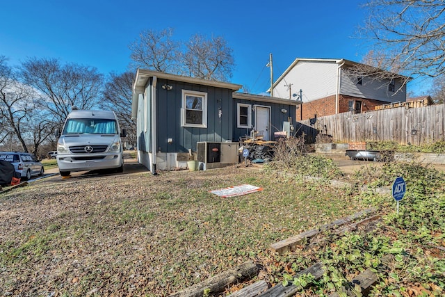 rear view of house with cooling unit