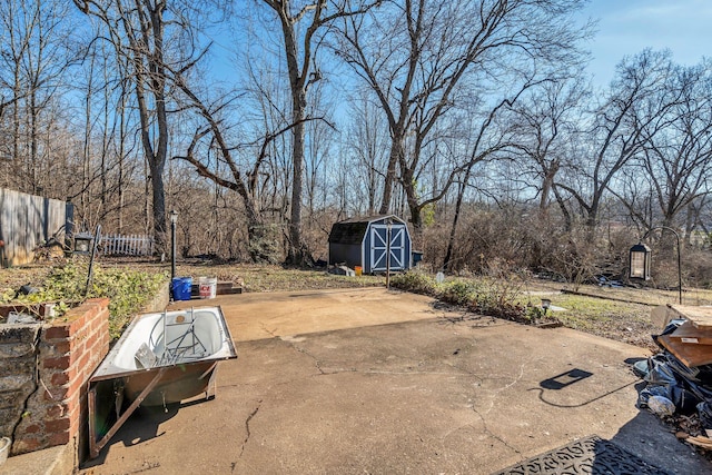 view of patio / terrace with a shed