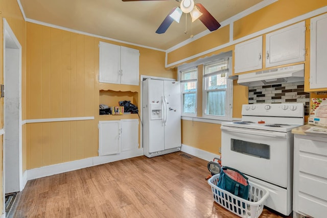 kitchen featuring white appliances, ornamental molding, light hardwood / wood-style floors, and white cabinets