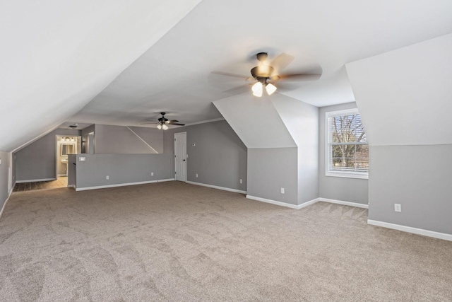 bonus room with lofted ceiling, carpet floors, and ceiling fan