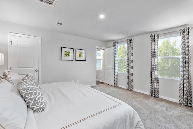 bedroom featuring light colored carpet