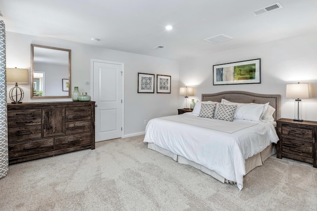 bedroom featuring light colored carpet