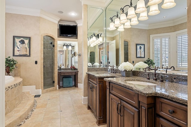 bathroom with vanity, ornamental molding, tile patterned floors, and shower with separate bathtub