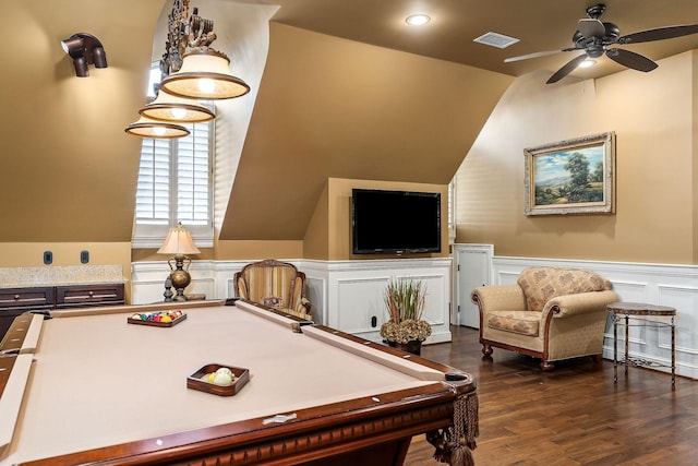 playroom with dark hardwood / wood-style flooring, vaulted ceiling, and ceiling fan