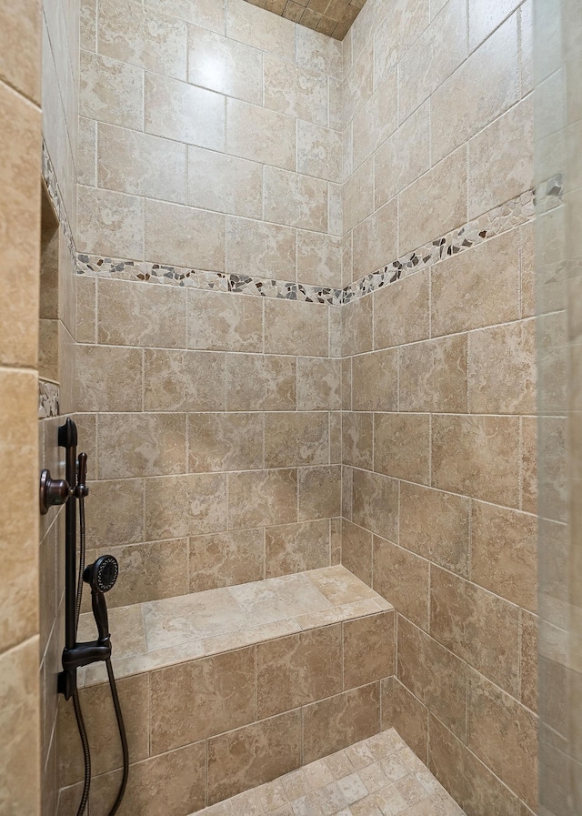 bathroom featuring tiled shower