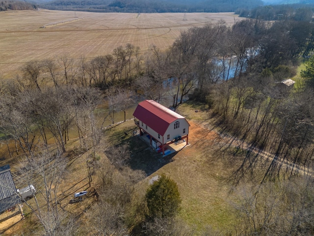 birds eye view of property with a rural view