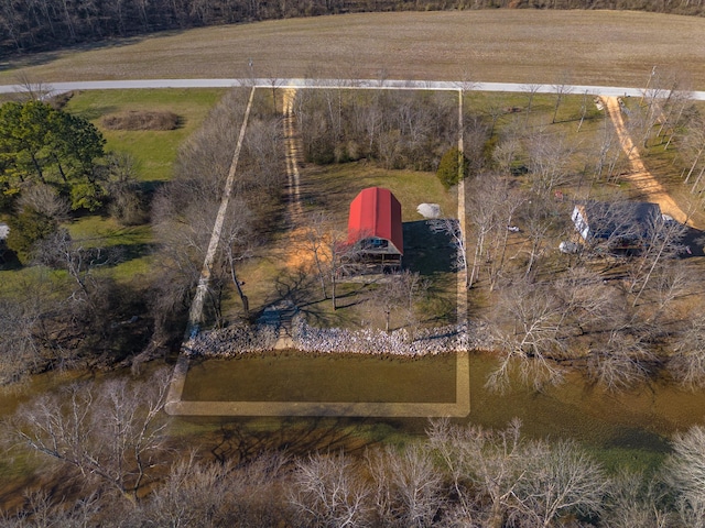 birds eye view of property with a water view and a rural view