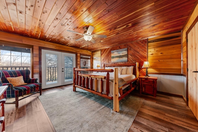 bedroom with french doors, wood walls, wooden ceiling, dark hardwood / wood-style flooring, and access to exterior