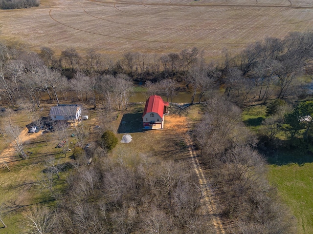 birds eye view of property with a rural view