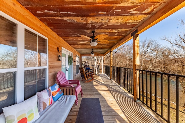 wooden deck with ceiling fan