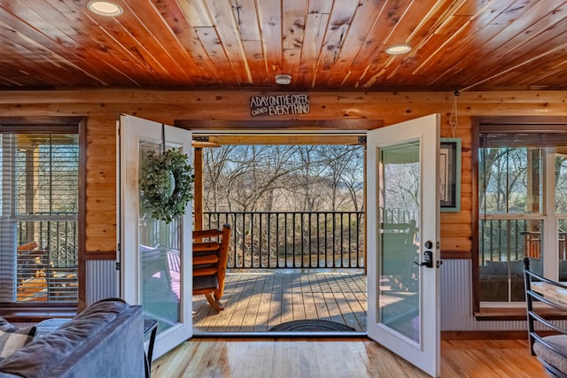 doorway to outside with light hardwood / wood-style floors