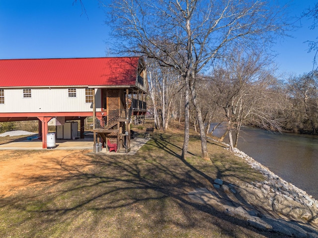 bi-level home featuring a water view