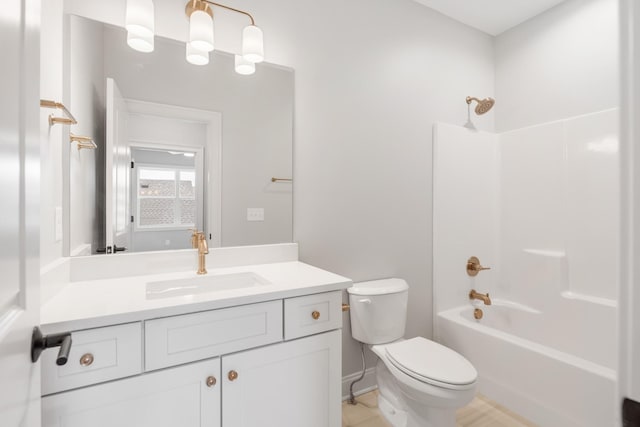 full bathroom with shower / tub combination, vanity, and toilet