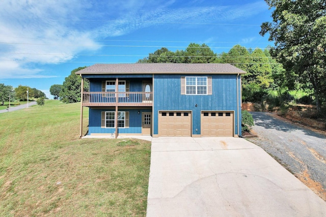 view of front facade featuring roof with shingles, concrete driveway, a front yard, a balcony, and a garage