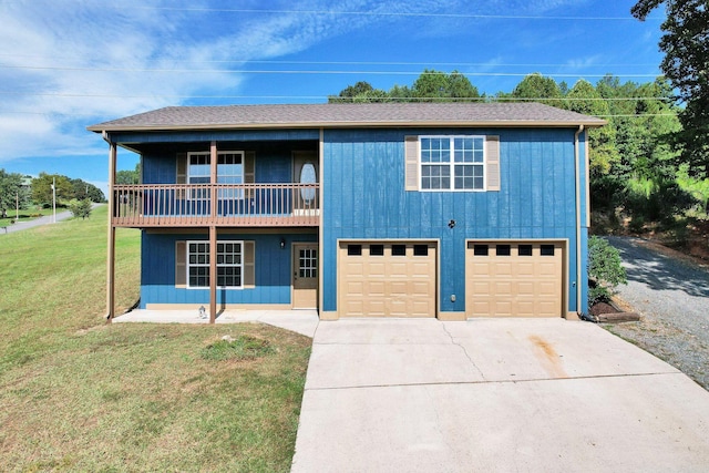 view of front of house featuring roof with shingles, concrete driveway, an attached garage, a front yard, and a balcony