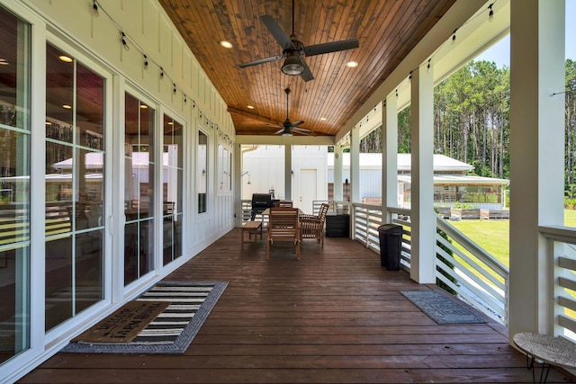 deck with a porch and ceiling fan