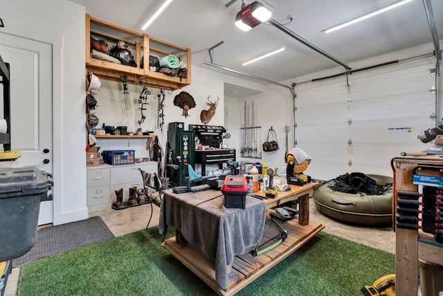 garage featuring a garage door opener and a workshop area