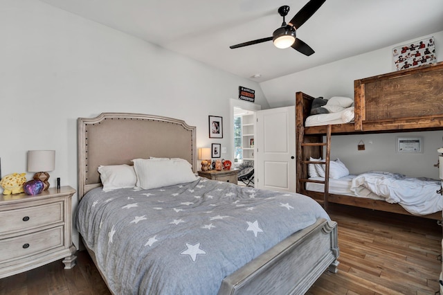 bedroom with vaulted ceiling, dark wood-type flooring, and ceiling fan