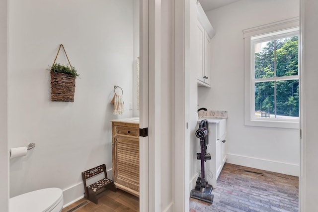 bathroom with vanity and toilet