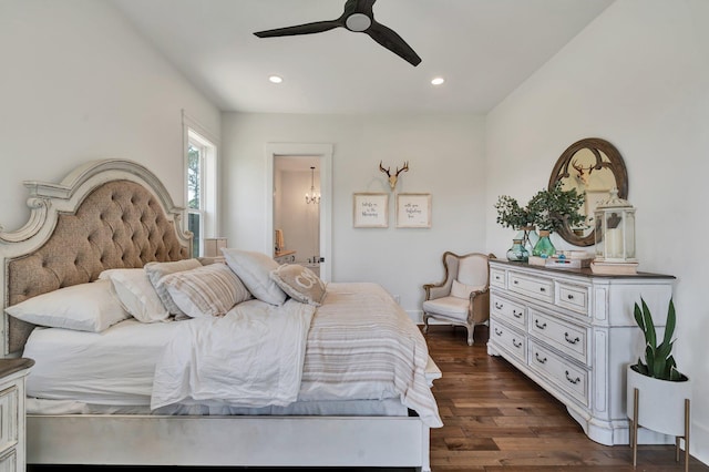 bedroom featuring dark hardwood / wood-style flooring and ceiling fan