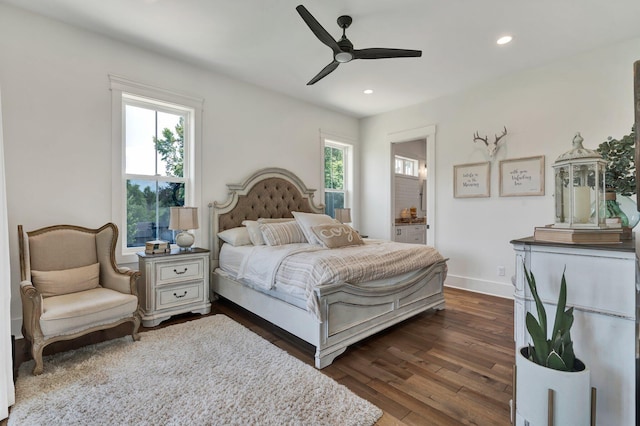 bedroom featuring multiple windows, dark wood-type flooring, and ceiling fan