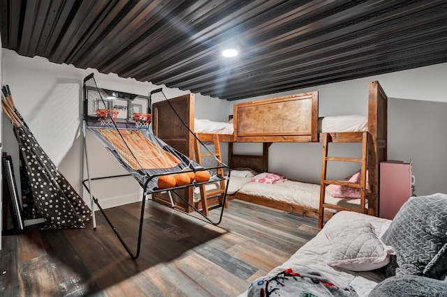 bedroom with wood-type flooring