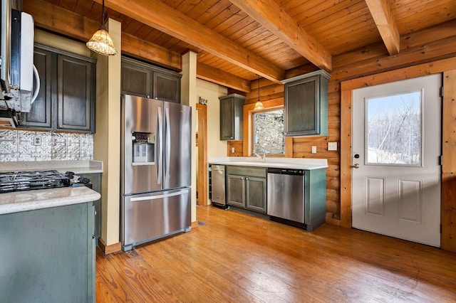 kitchen featuring appliances with stainless steel finishes, pendant lighting, beamed ceiling, wood ceiling, and light hardwood / wood-style flooring