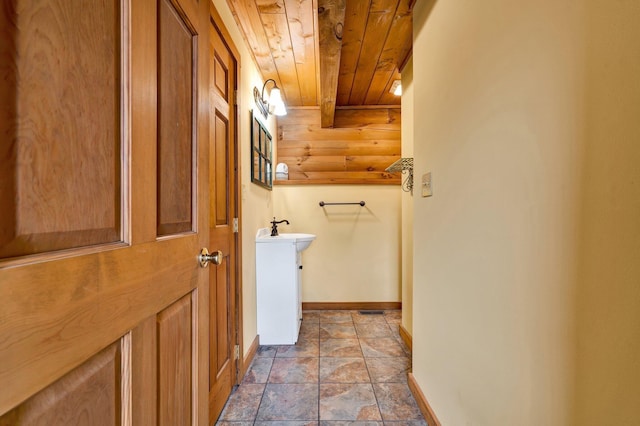 washroom with wood ceiling