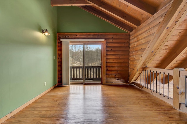 bonus room with rustic walls, high vaulted ceiling, wooden ceiling, beam ceiling, and hardwood / wood-style floors