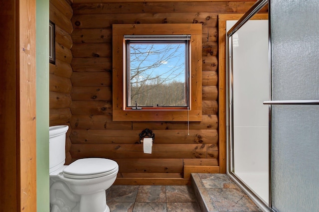 bathroom with log walls and toilet