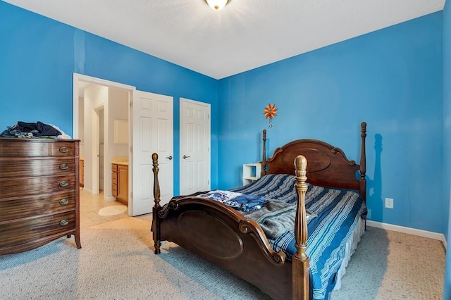 bedroom featuring connected bathroom