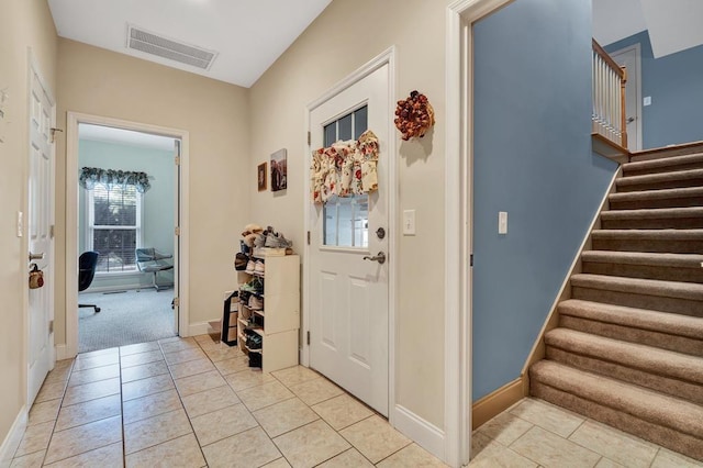 entryway featuring light tile patterned flooring