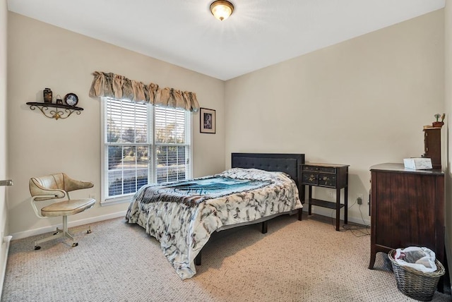 bedroom featuring light colored carpet