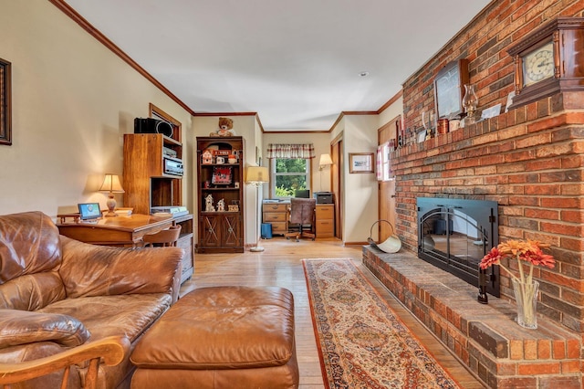 living room with a brick fireplace, ornamental molding, and light wood-type flooring