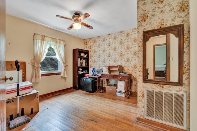 misc room with ceiling fan and light hardwood / wood-style flooring