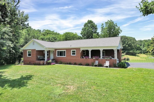 ranch-style home with a front lawn